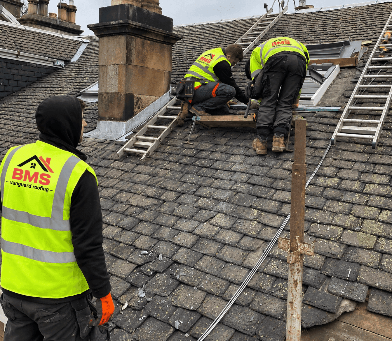 BMS Vanguard roofing team working on a slate roof