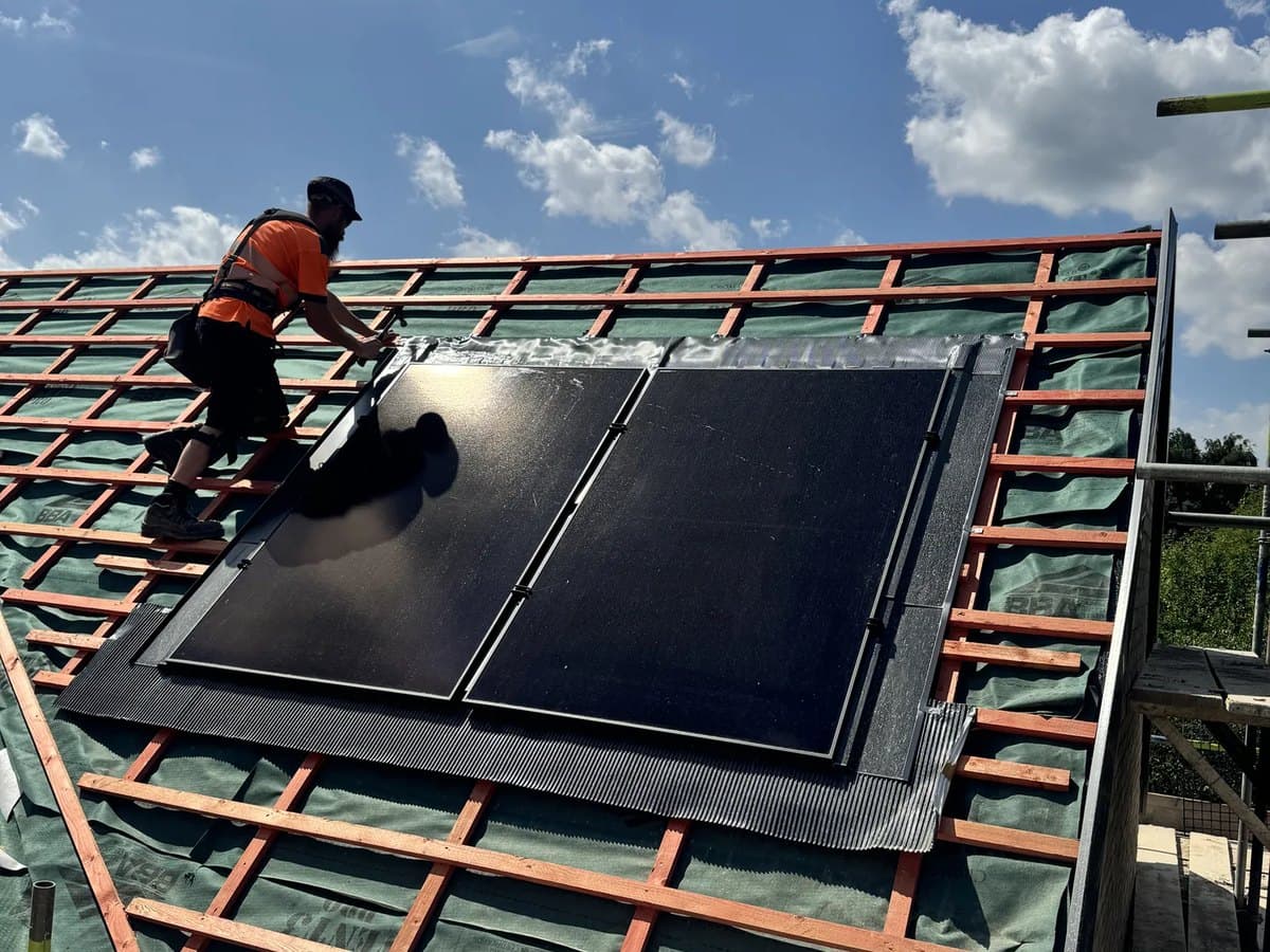 In-roof solar panels being fitted during a re-roof