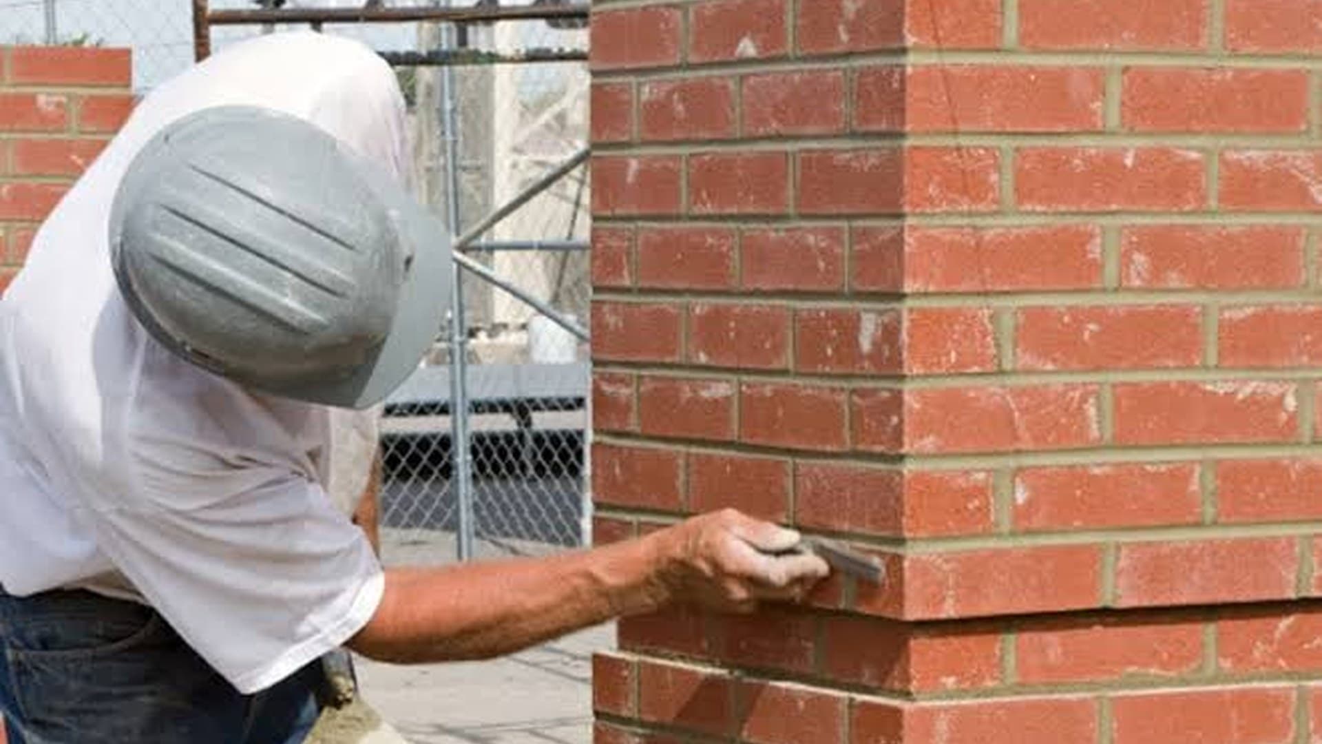 Mortar joints being re-pointed on a brick pier