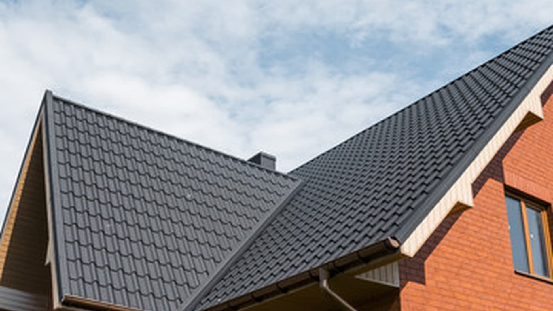 Tiled roof on a brick house