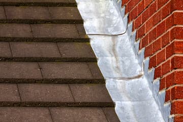 Lead flashing where a roof meets a brick wall